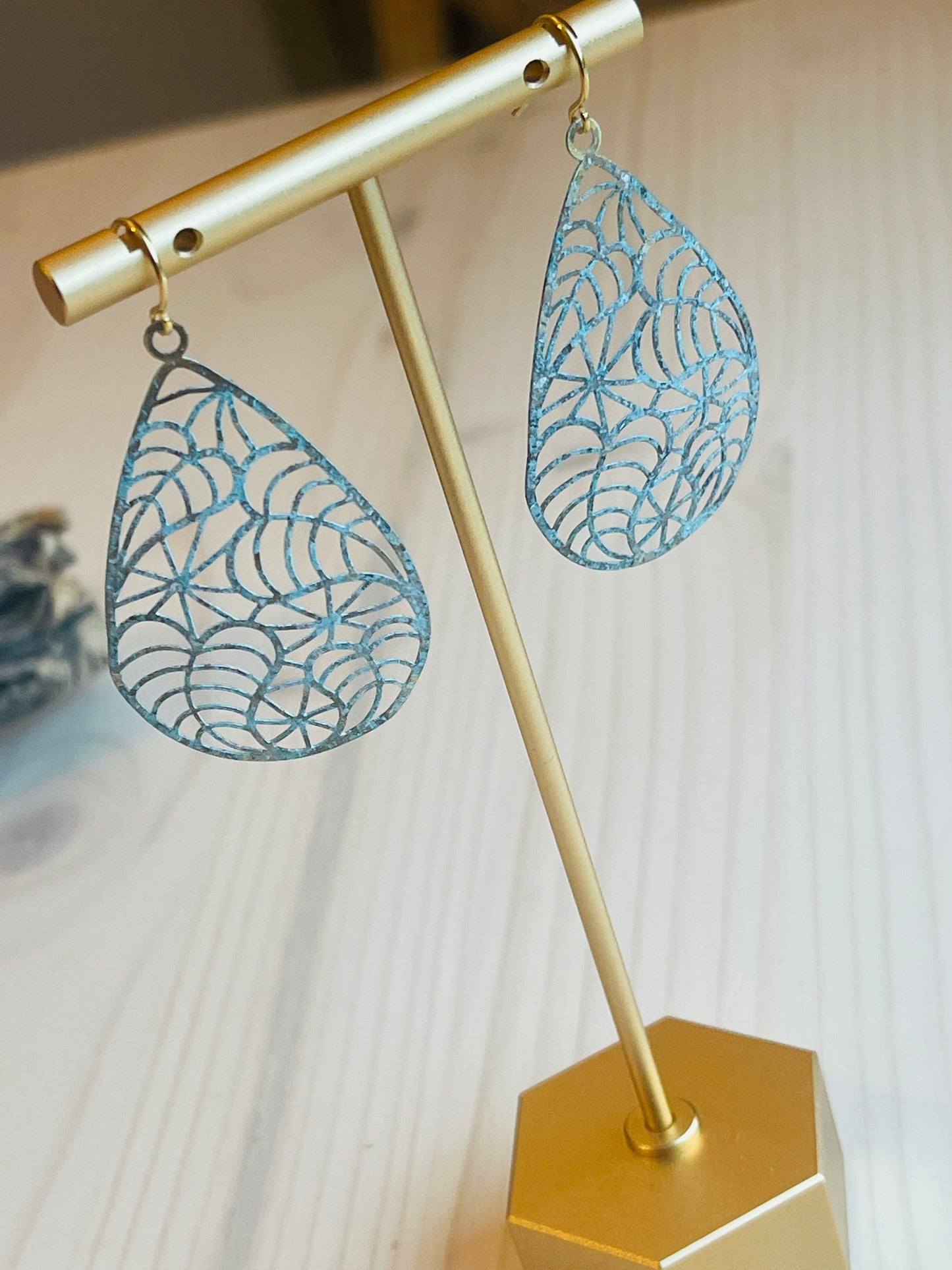 Heather Earrings Made in the USA on t shaped display on table
