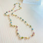 Tourmaline Choker with blue hoop earrings in the background