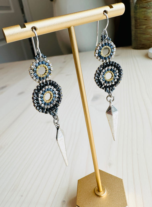 Eyelet Earrings on display stand.