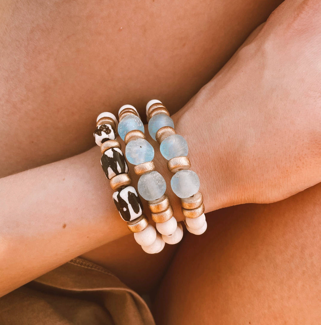 Ocean and Zebra Batik Island Bracelets on wrist in lab that are Handmade in the USA