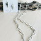 Dyan Necklace Handcrafted by BluEyed Horse in the USA on mannequin display with heart shaped earrings