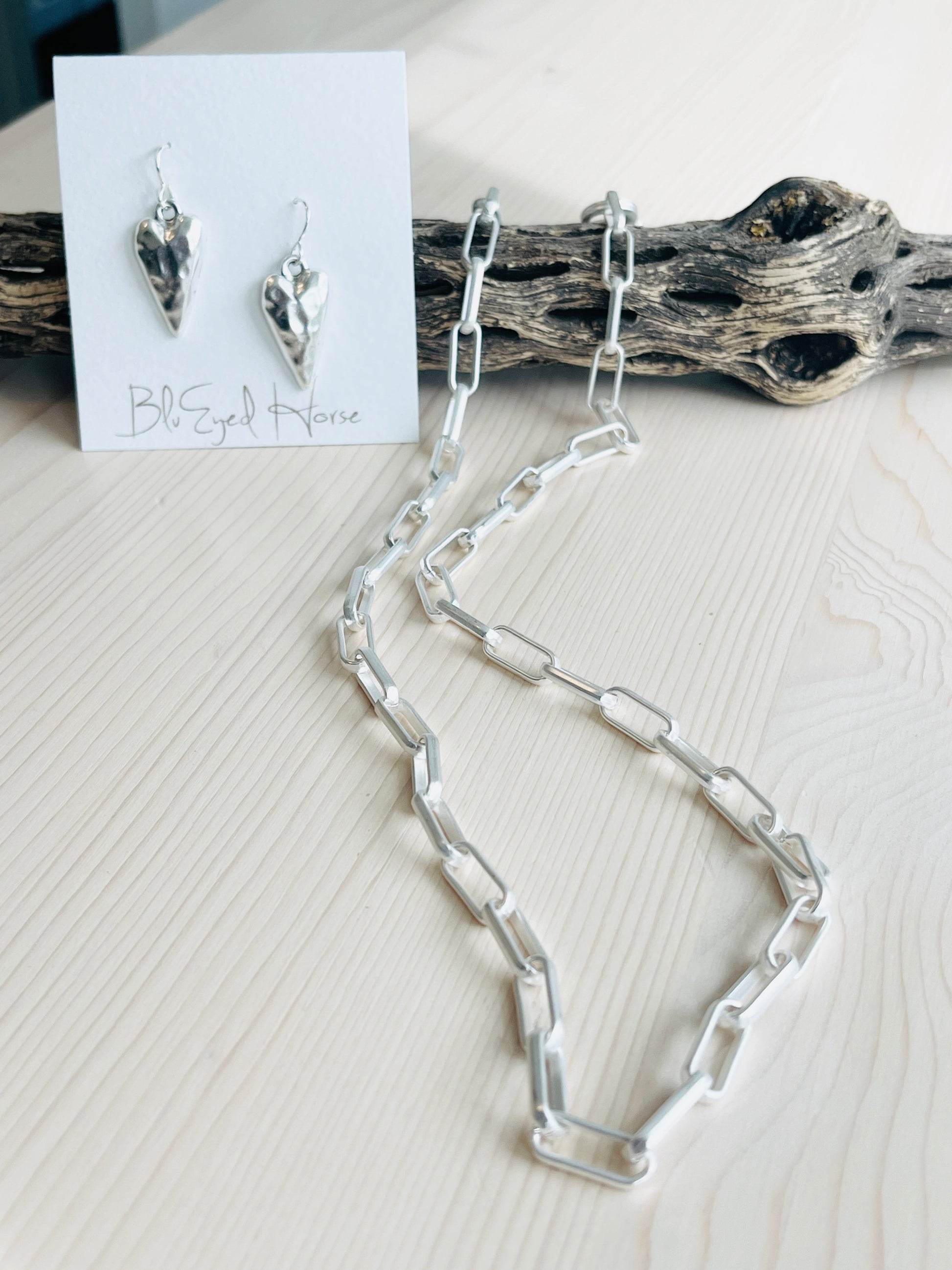 Dyan Necklace Handcrafted by BluEyed Horse in the USA on mannequin display with heart shaped earrings