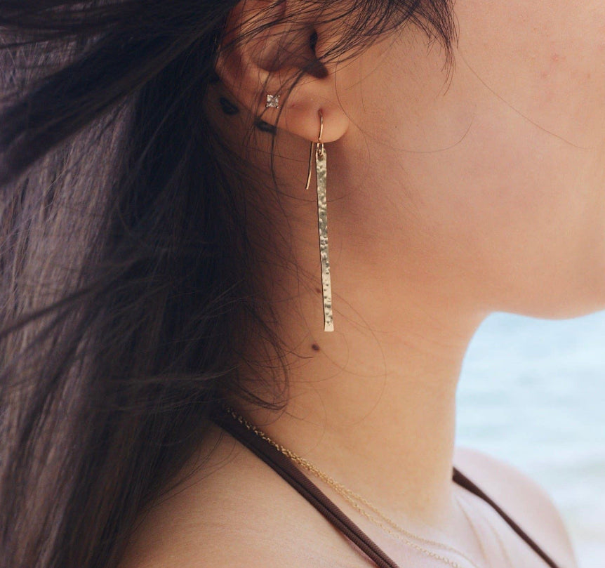 Female right ear wearing Hammered Bar Earrings that are Handmade in the USA