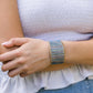 Woman wearing a handmade adjustable brass and copper ring 