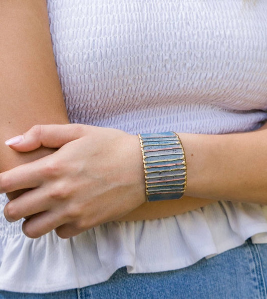 Woman wearing a handmade adjustable brass and copper ring 