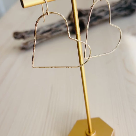 Video of Gold Heart Earrings displayed on t-shaped stand