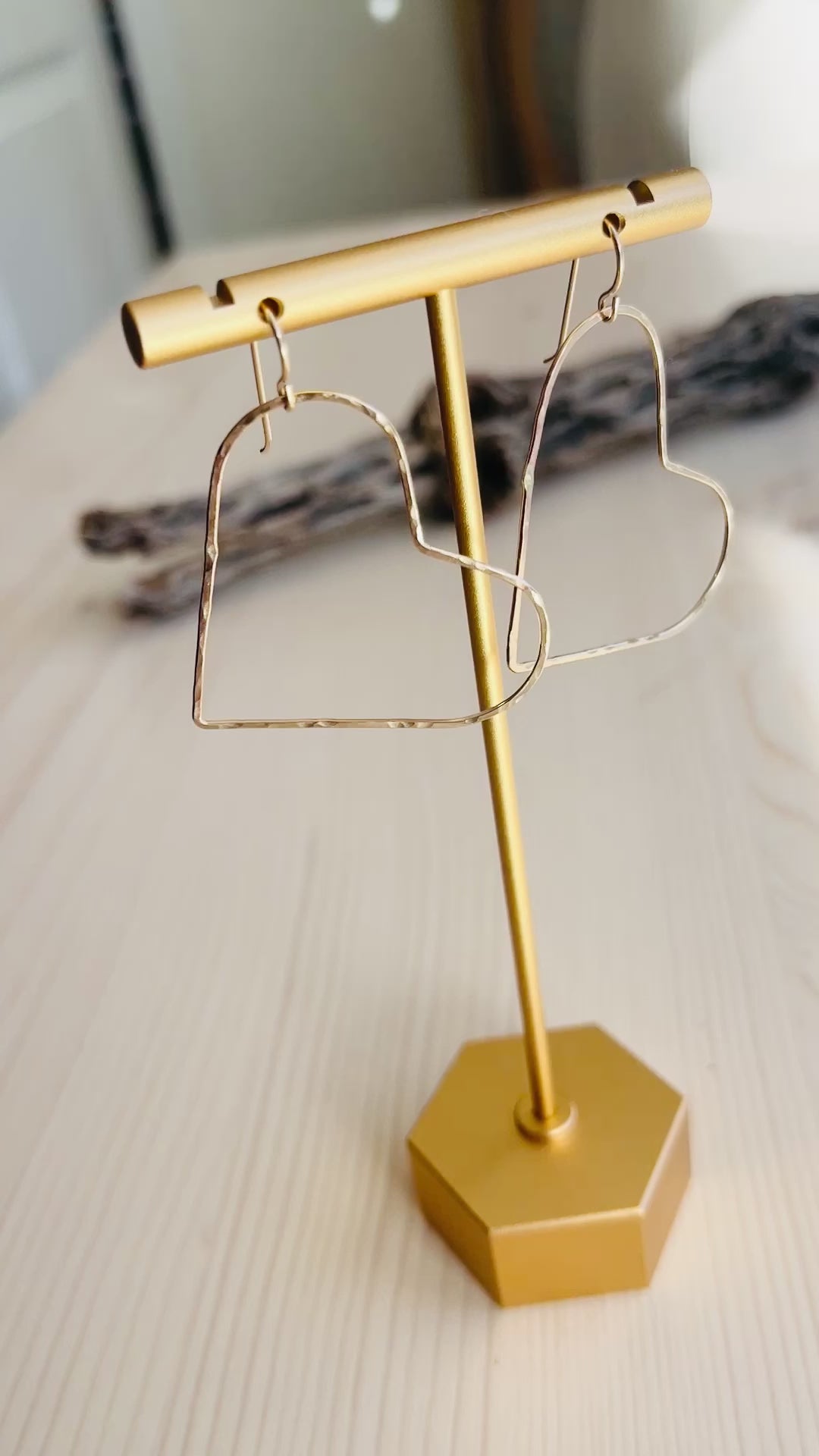 Video of Gold Heart Earrings displayed on t-shaped stand