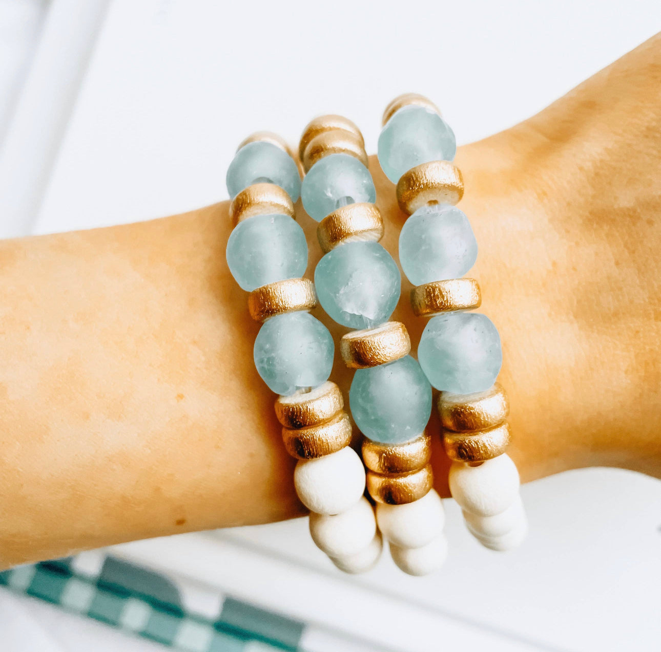 Three Ocean Island Bracelets on wrist that are Handmade in the USA