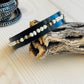 Blair Bracelet displayed on driftwood