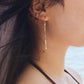 Female right ear wearing Hammered Bar Earrings that are Handmade in the USA