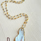 D.  Oyster shell with mystic labradorite and amber gemstone beaded chain.