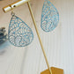 Heather Earrings Made in the USA on t shaped display on table