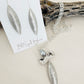 Taylor Necklace Handmade in USA displayed on top of driftwood with earrings