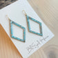 Cassidy Earrings Made in the USA with drift wood in background