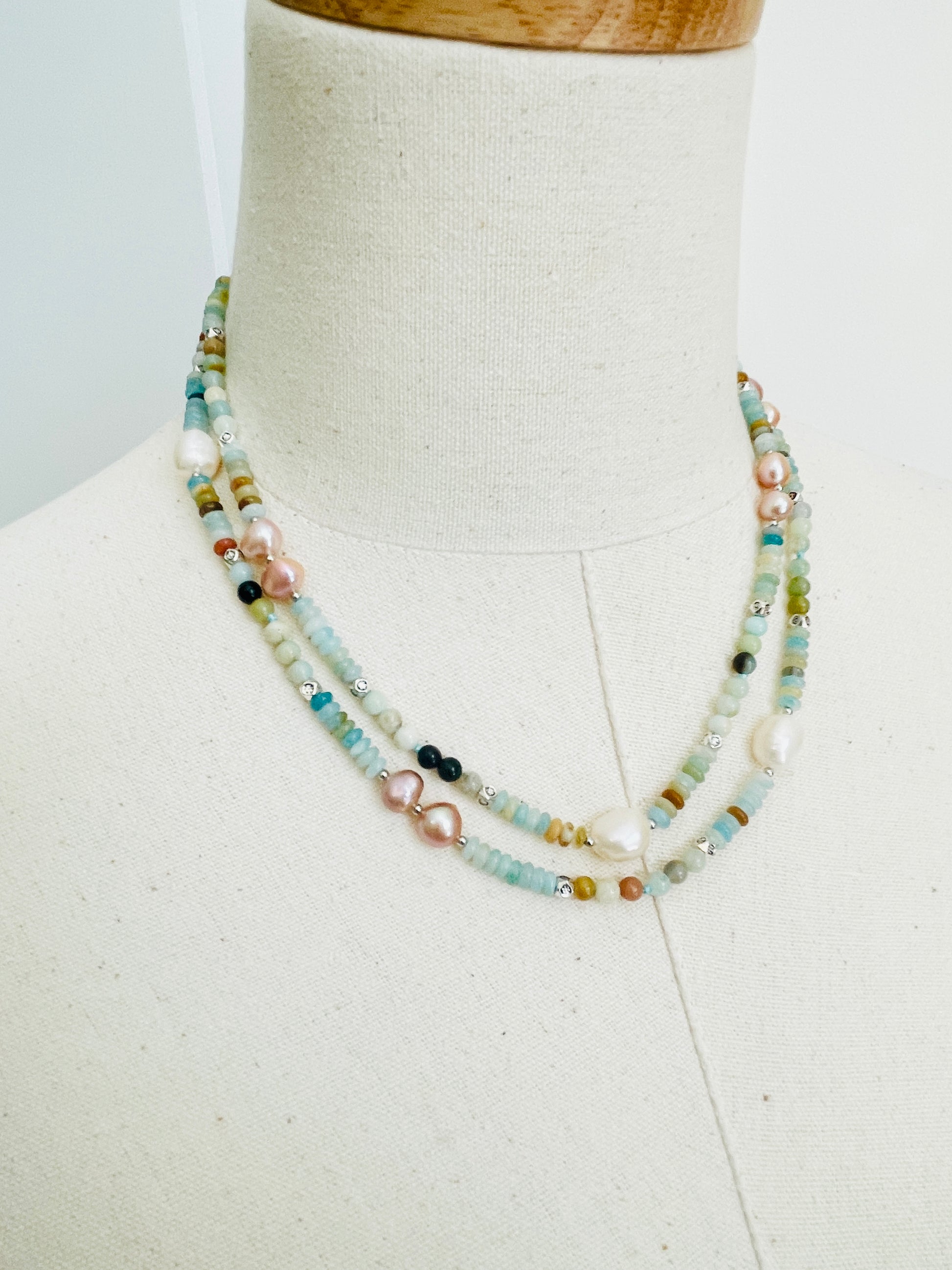 Green Cove Necklace displayed on mannequin