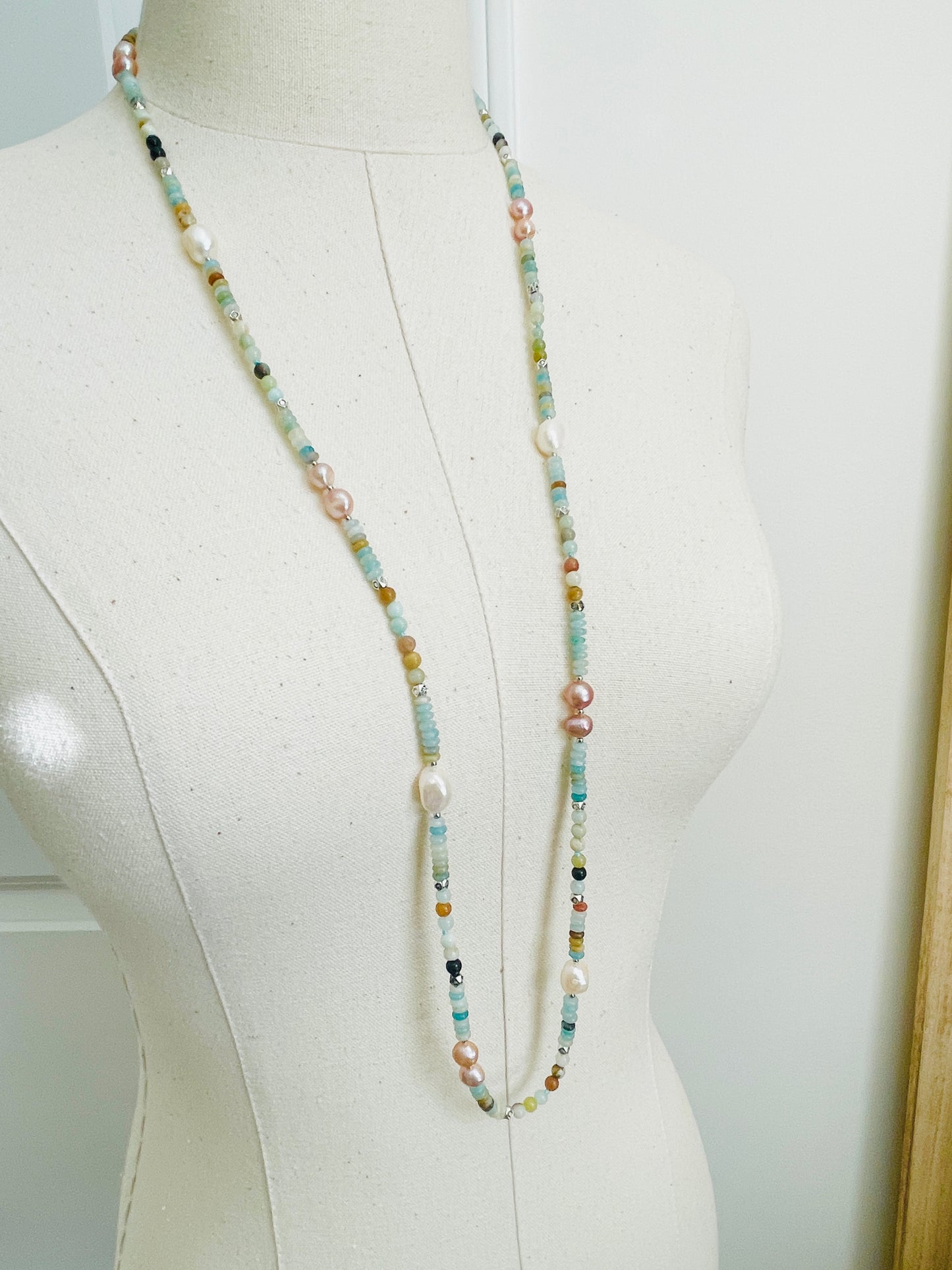 Green Cove Necklace displayed on mannequin