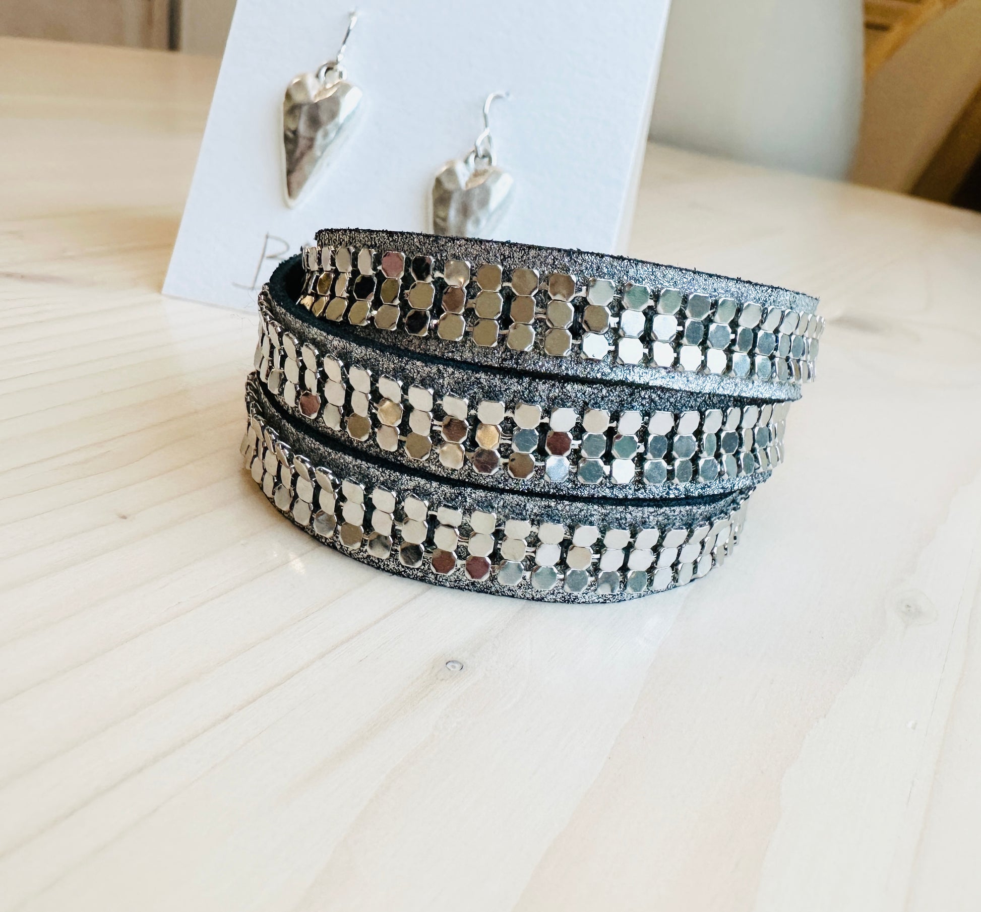 Twilight Wrap Bracelet and heart shaped earrings on table that are  Handmade in the USA