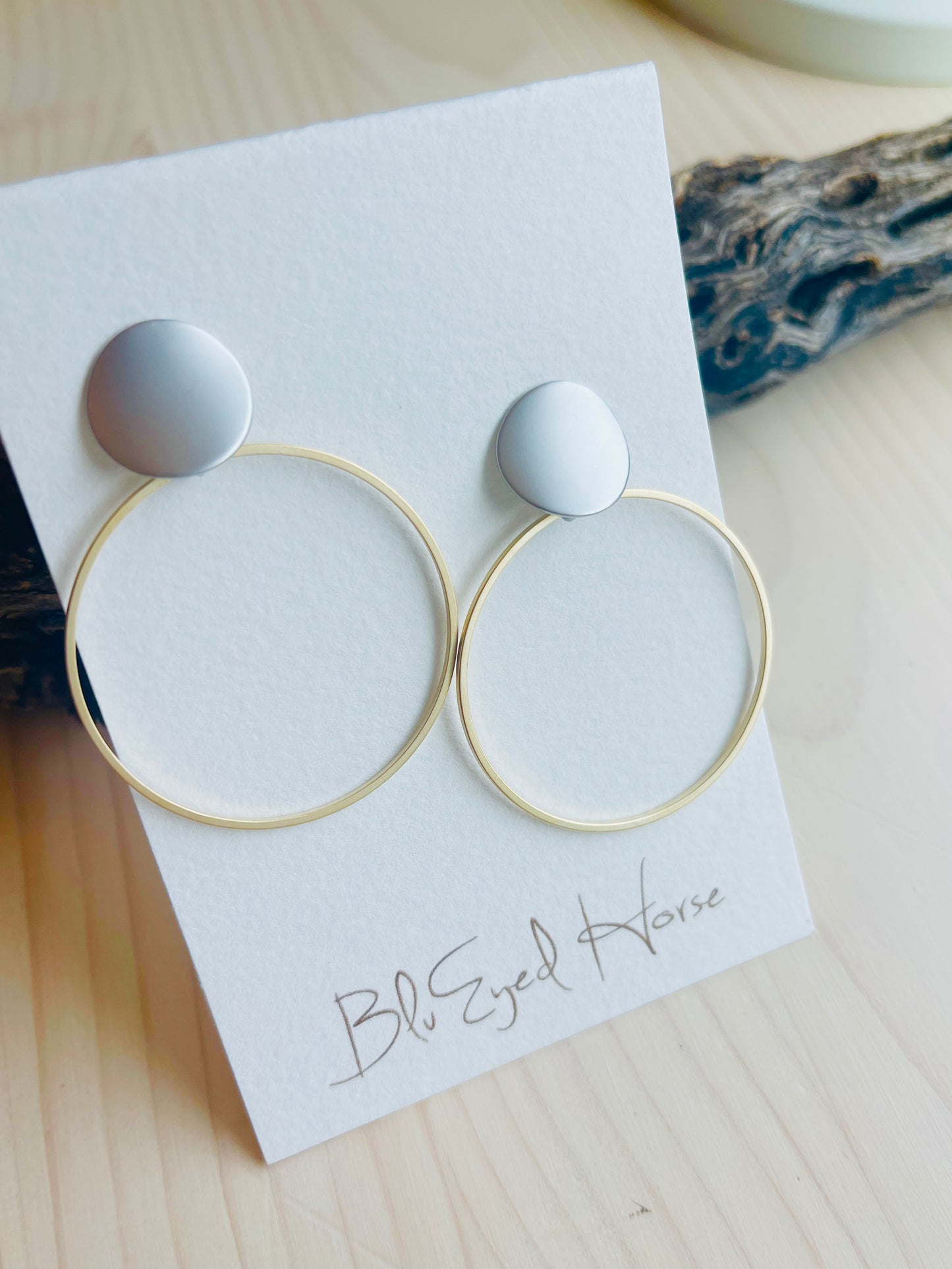 LuLu Earrings Made in the USA with driftwood in background