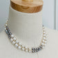 Ivory & Peacock Pearl Necklace displayed on mannequin