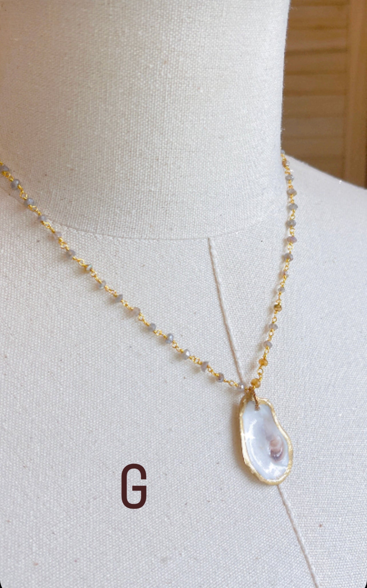 G.  Oyster shell with mystic labradorite and amber gemstone beaded chain. 