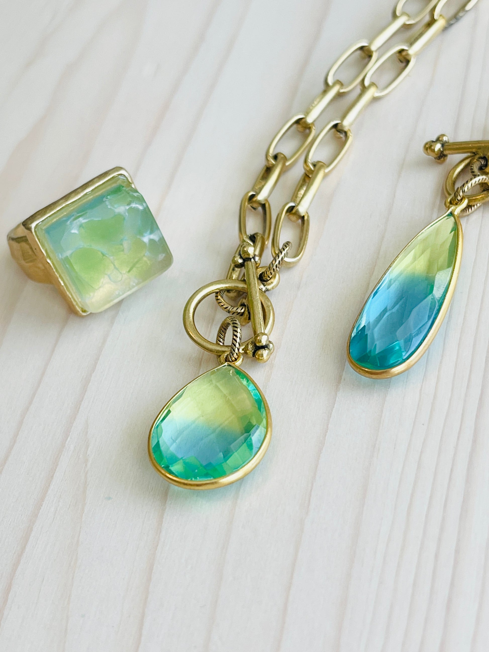 Ocean Quartz Necklace with matching ring that are Handmade in the USA on mannequin display.