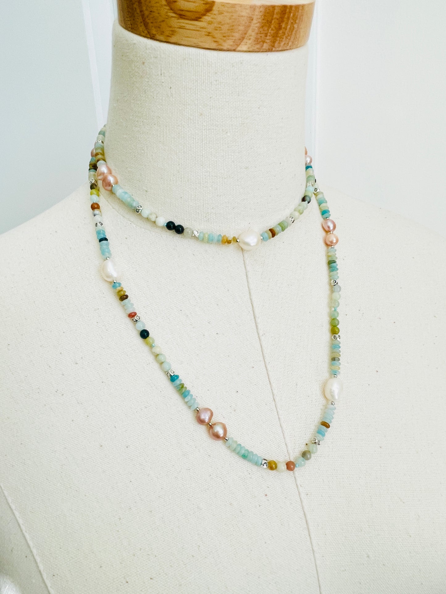 Green Cove Necklace displayed on mannequin
