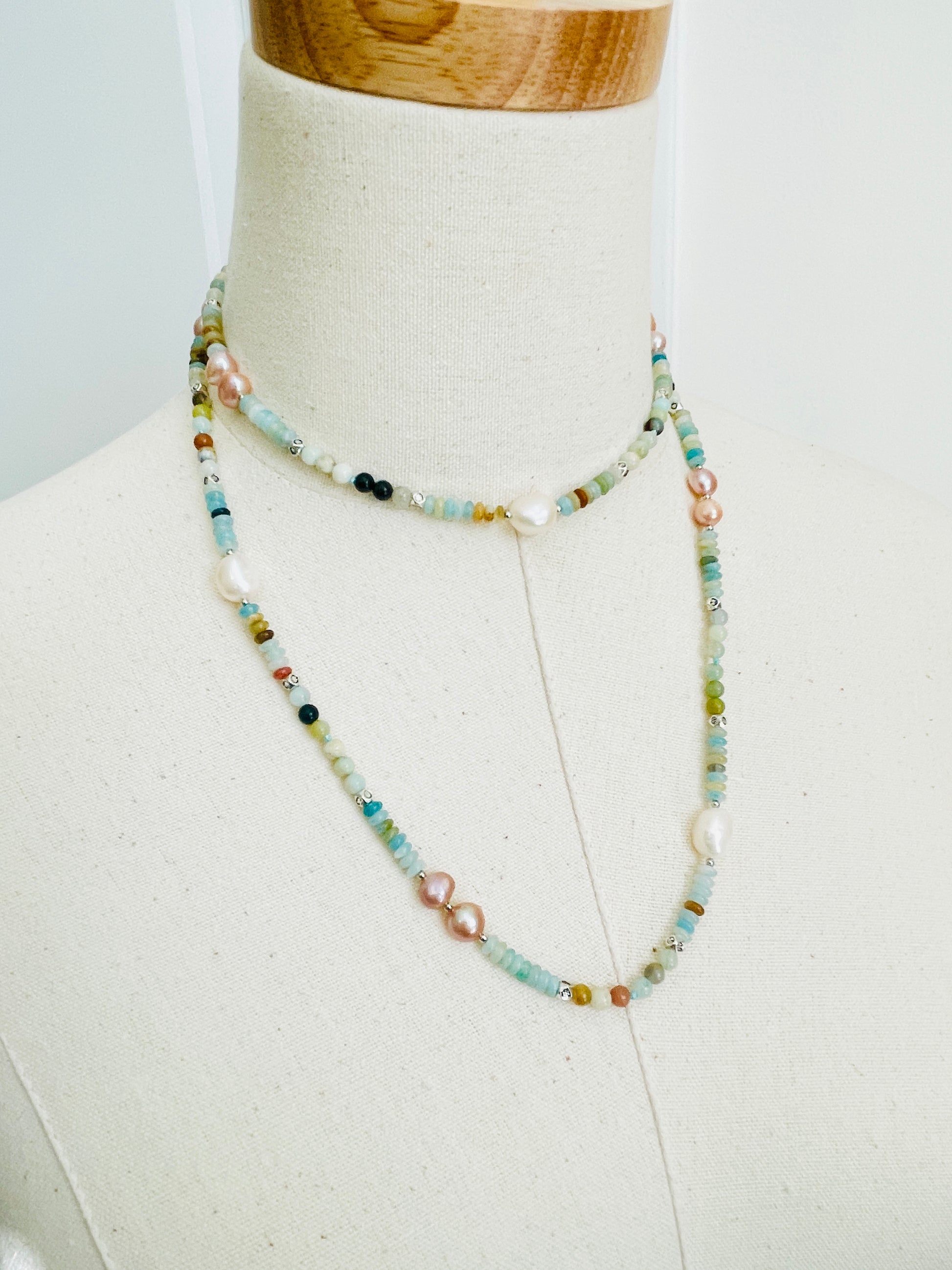 Green Cove Necklace displayed on mannequin