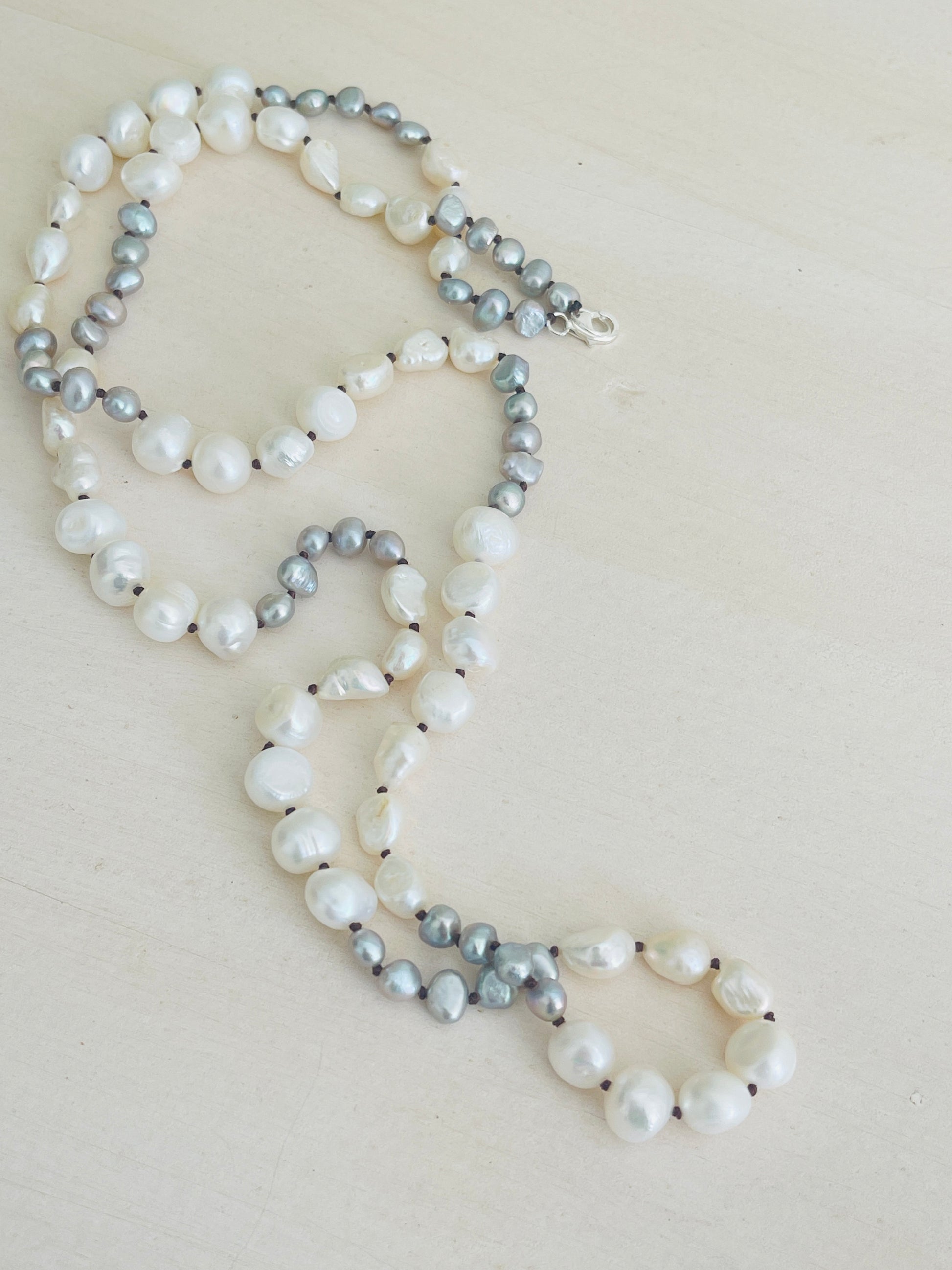 Ivory & Peacock Pearl Necklace displayed on mannequin