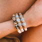 Ocean and Zebra Batik Island Bracelets on wrist in lab that are Handmade in the USA
