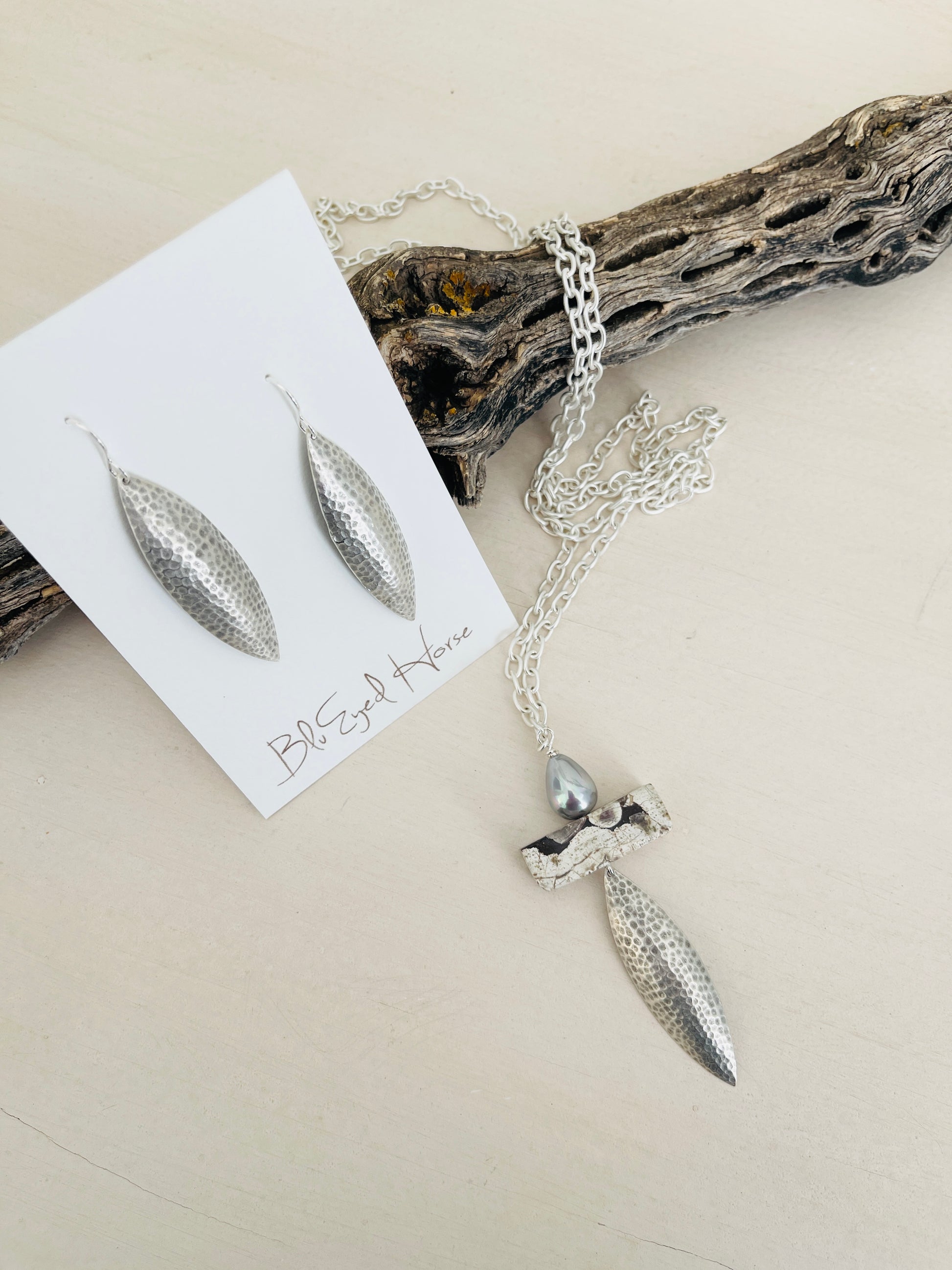 Taylor Necklace Handmade in USA displayed on top of driftwood with earrings