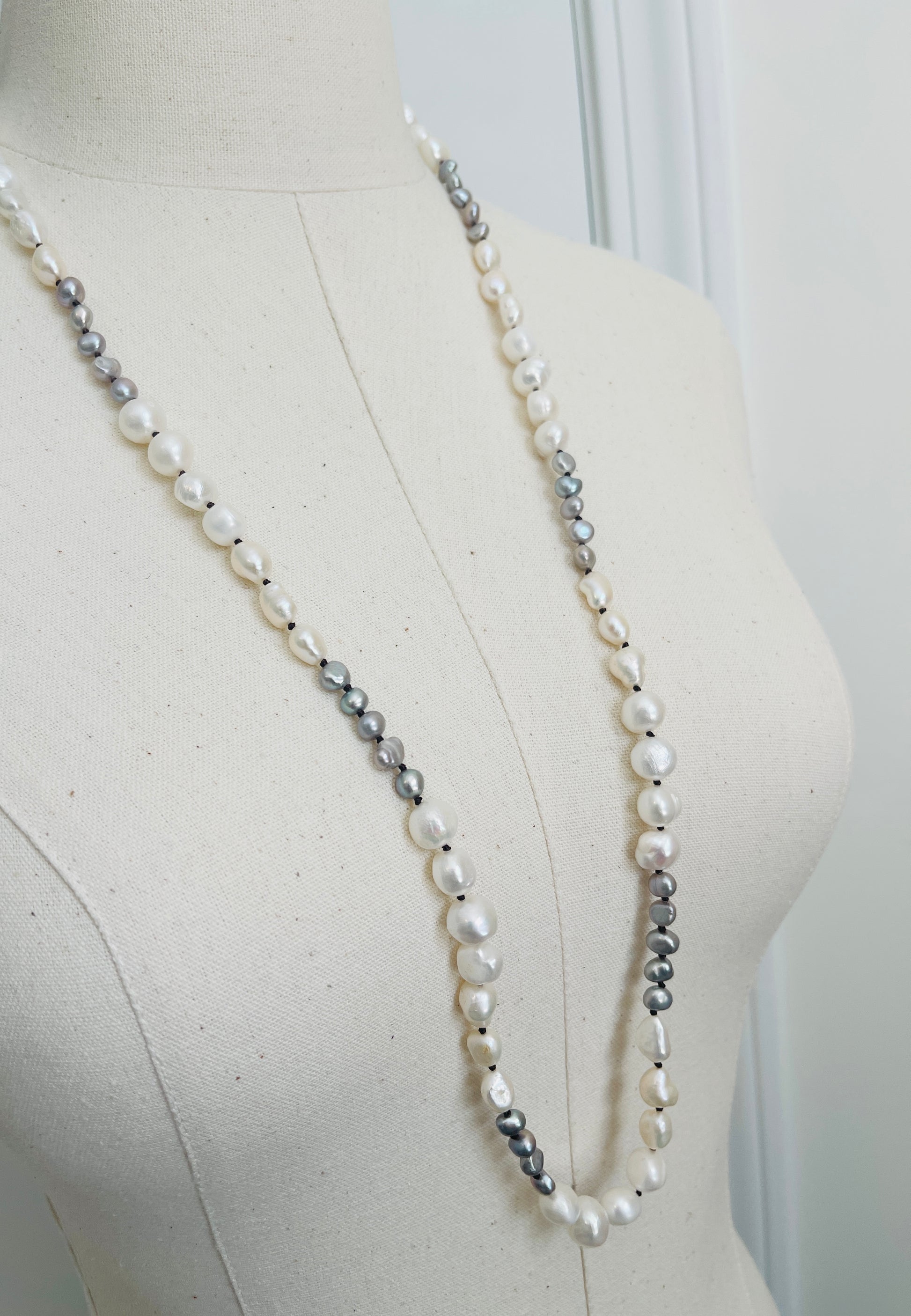 Ivory & Peacock Pearl Necklace displayed on mannequin