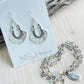Antique silver Morrocan style earrings with embossed black design detail.Shown here with the Believe bracelet and Lucy Choker.