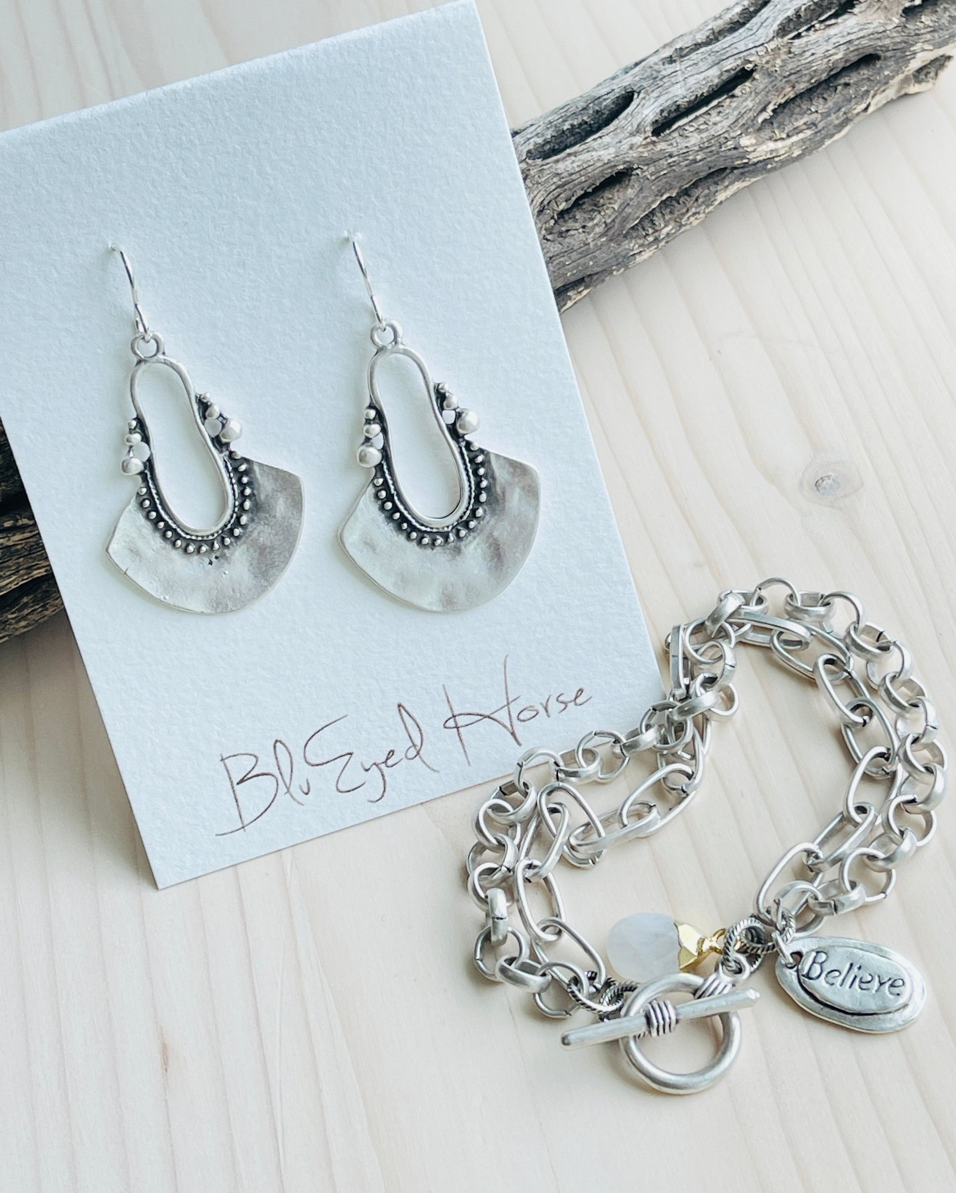 Antique silver Morrocan style earrings with embossed black design detail.Shown here with the Believe bracelet and Lucy Choker.